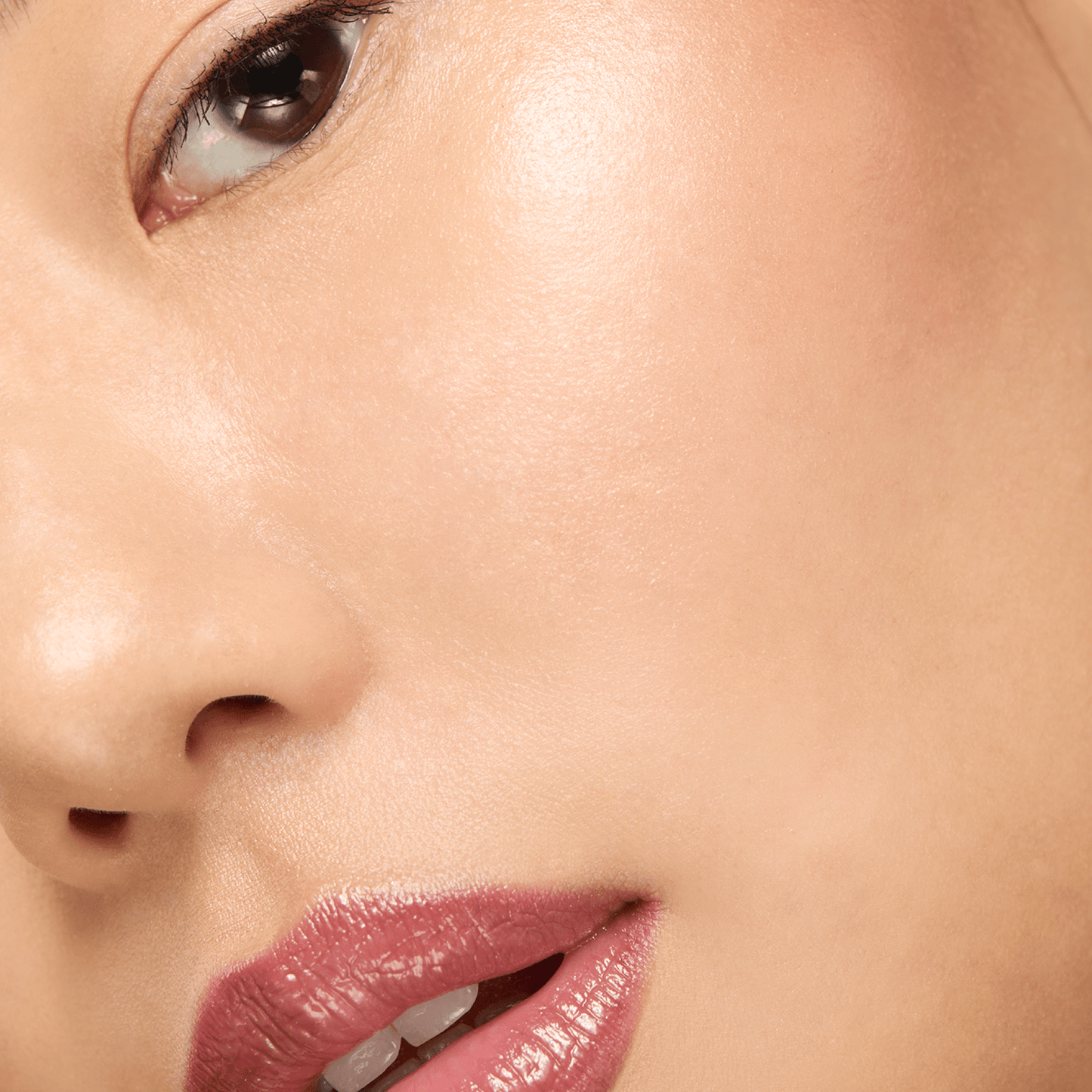 Close-up of a person's lips with a soft focus on the skin texture.
