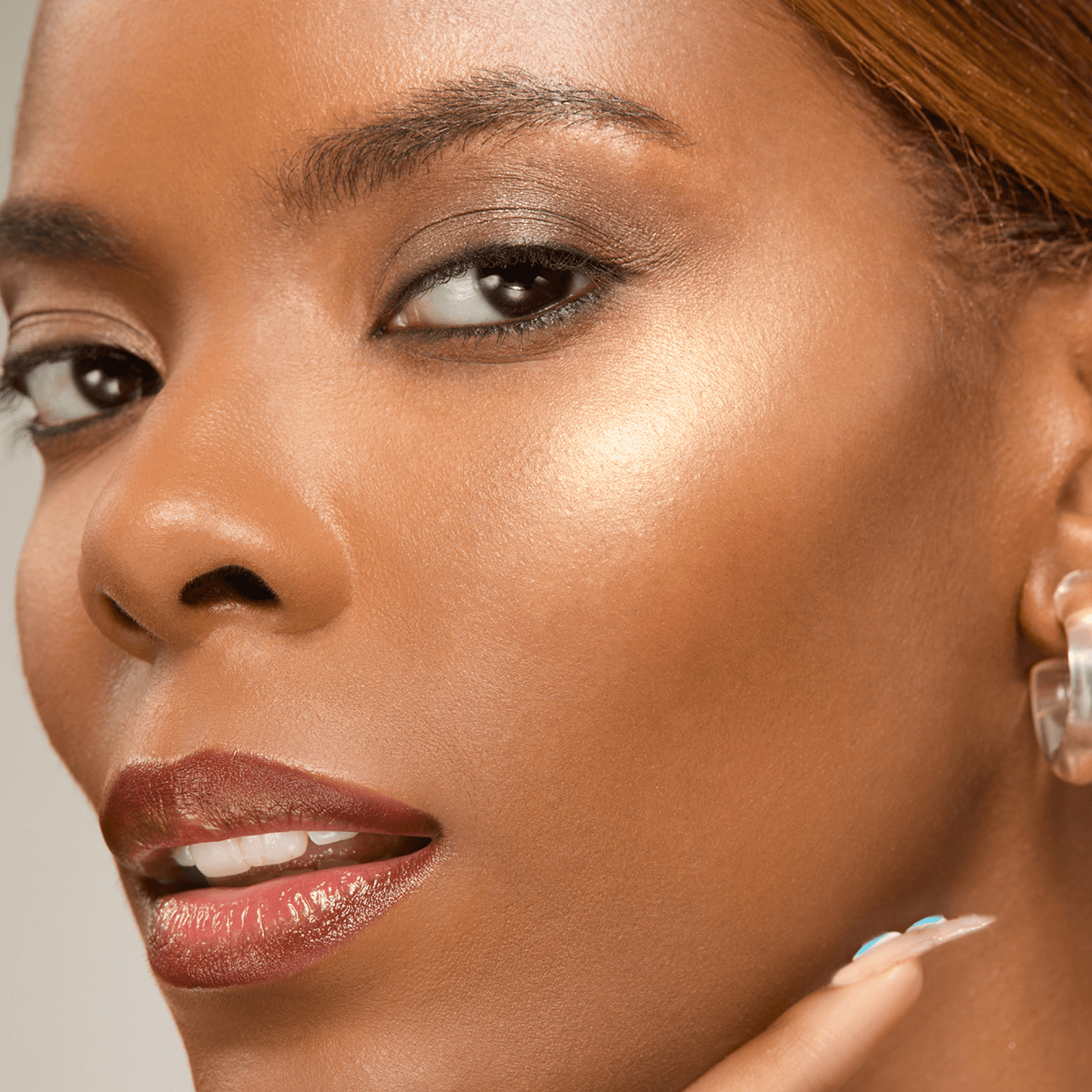 Close-up of a woman's face with a neutral background