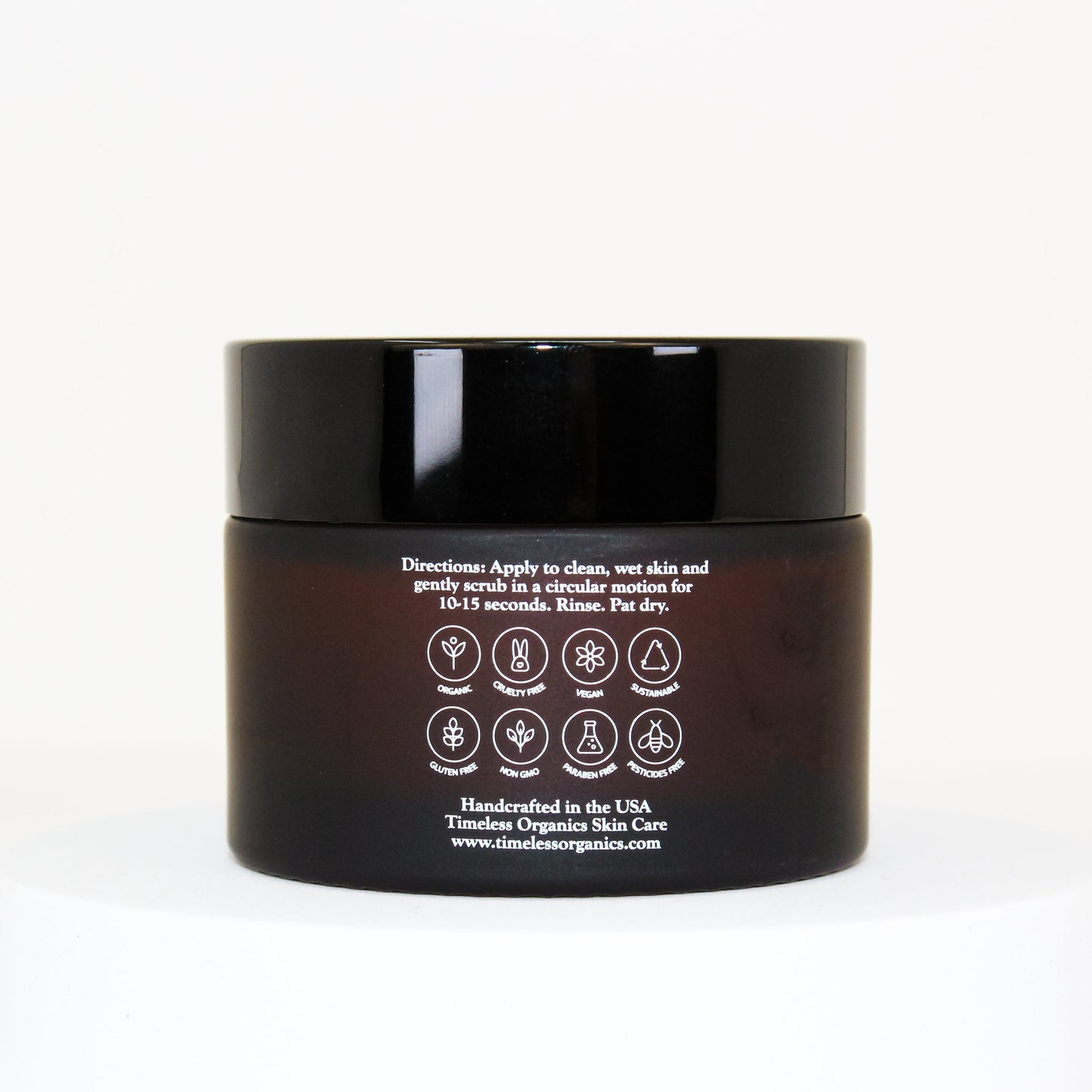 Black jar with white label on a white background