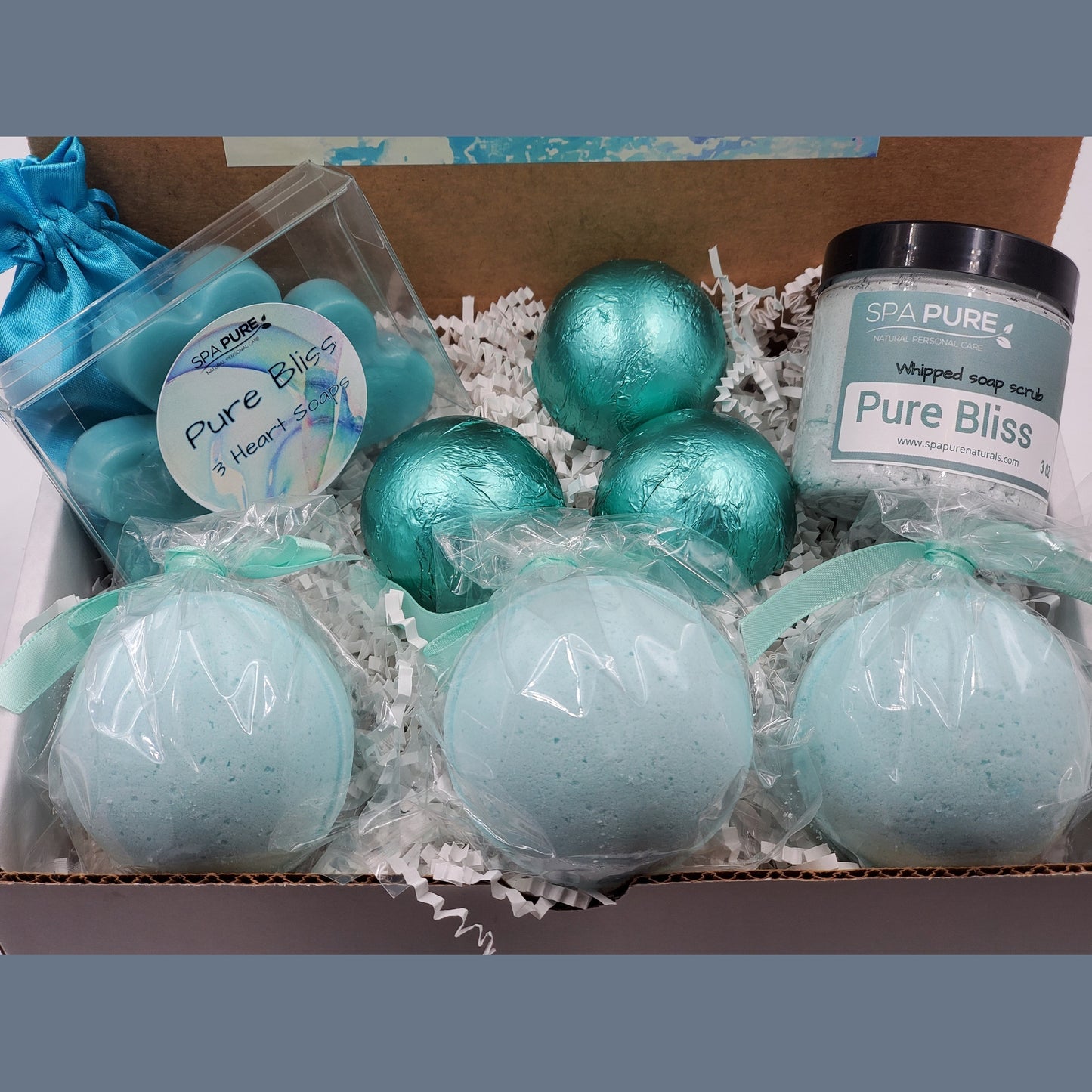 Spa Pure Luxury Spa Kit - Pure Bliss - 3 XL Pure Bliss Bath Fizzies, 3 Pure Bliss shower steamers, 3 Heart-shaped soaps, one 3.5 oz Pure Bliss whipped soap scrub, 1 Roll-on Perfume, Perfect for a mini-spa treatment.