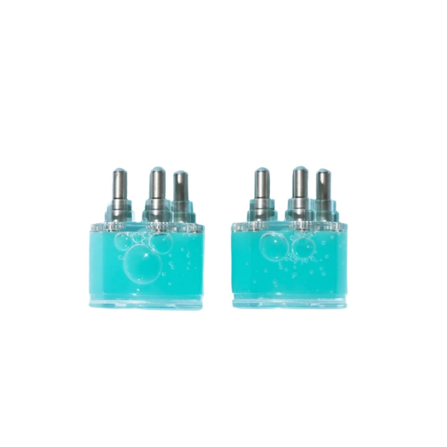Two turquoise bottles with silver caps on a light background