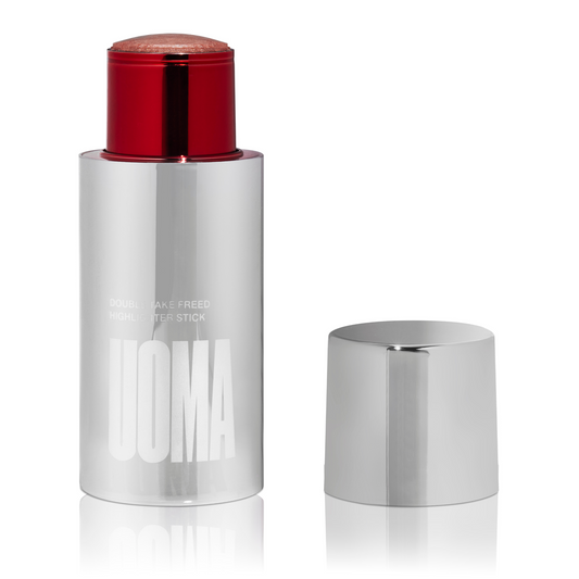 Silver makeup stick with red top on a white background