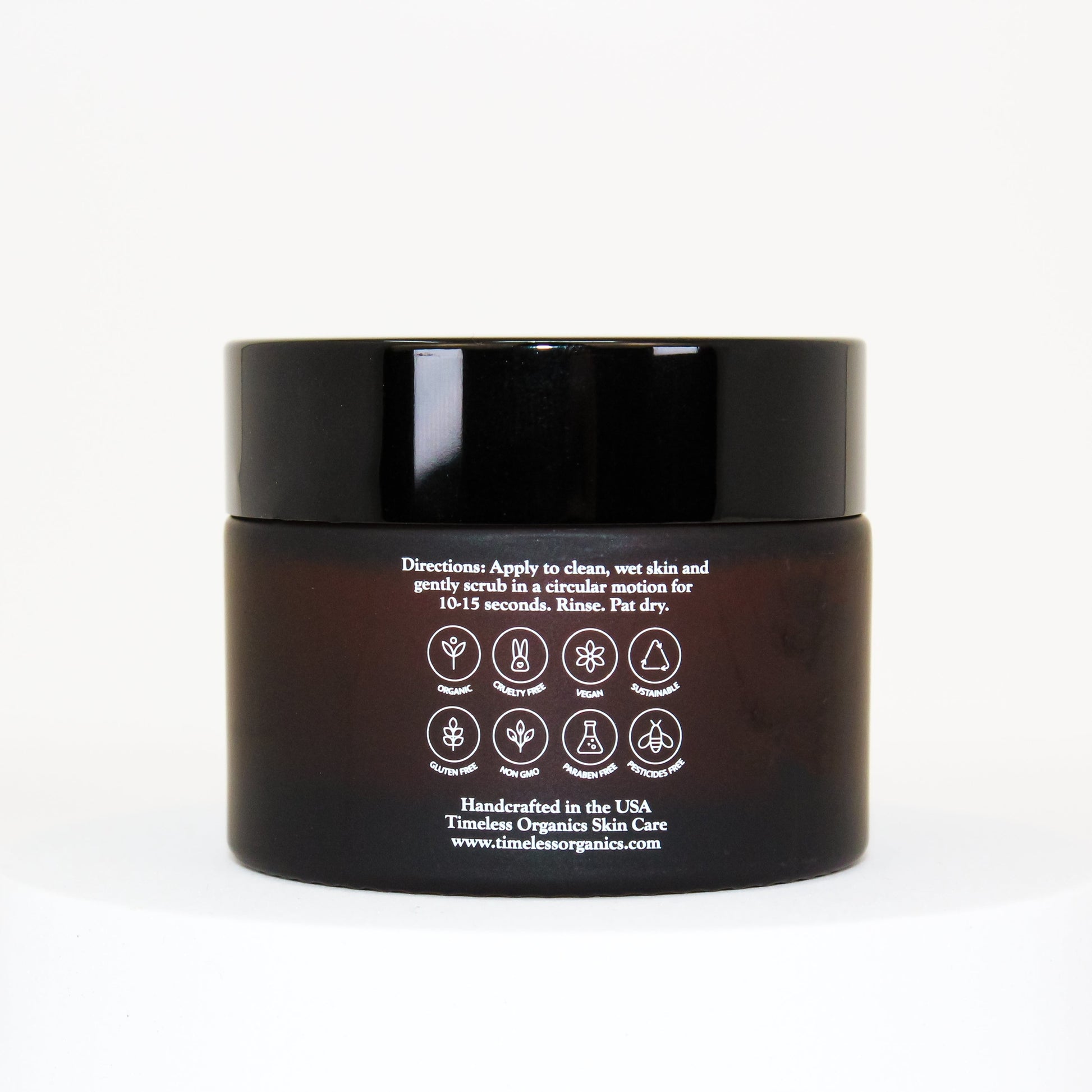 Black jar with white label on a white background