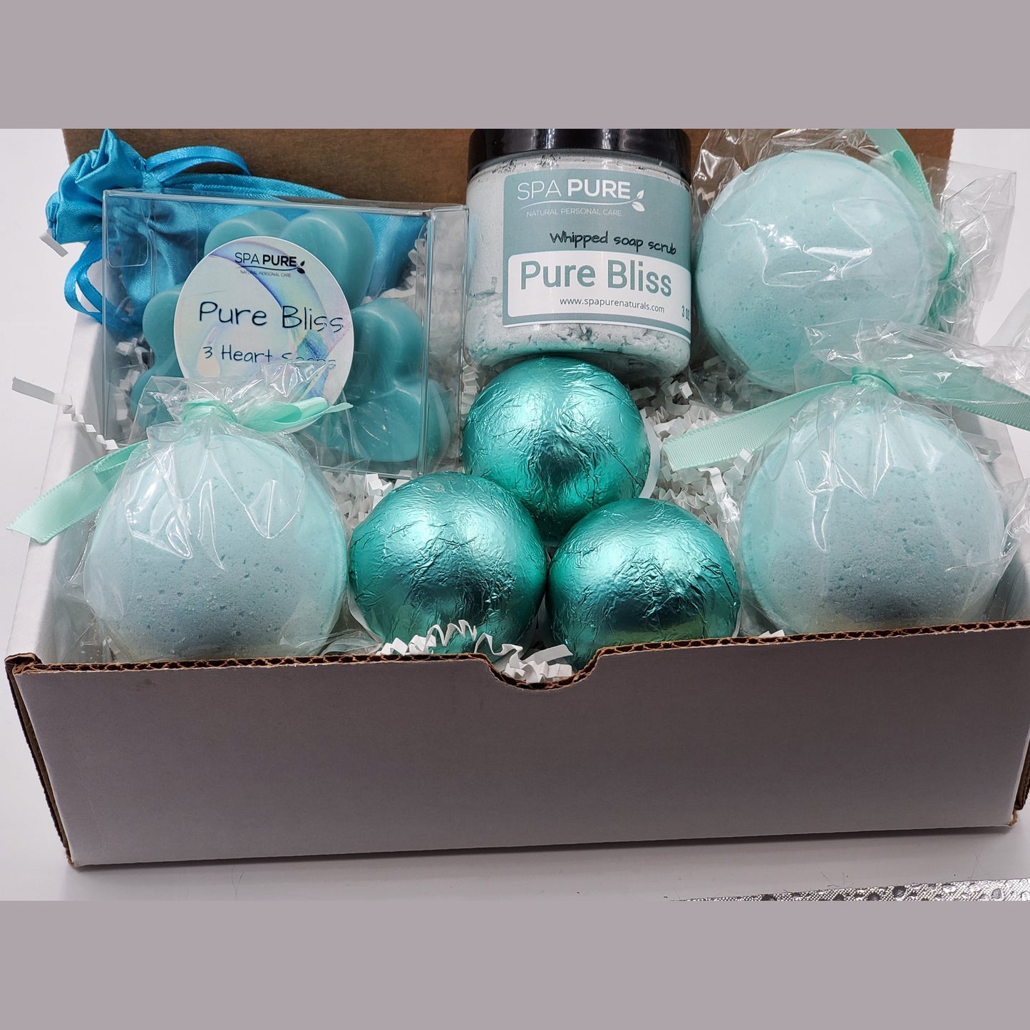 Spa Pure Luxury Spa Kit - Pure Bliss - 3 XL Pure Bliss Bath Fizzies, 3 Pure Bliss shower steamers, 3 Heart-shaped soaps, one 3.5 oz Pure Bliss whipped soap scrub, 1 Roll-on Perfume, Perfect for a mini-spa treatment.
