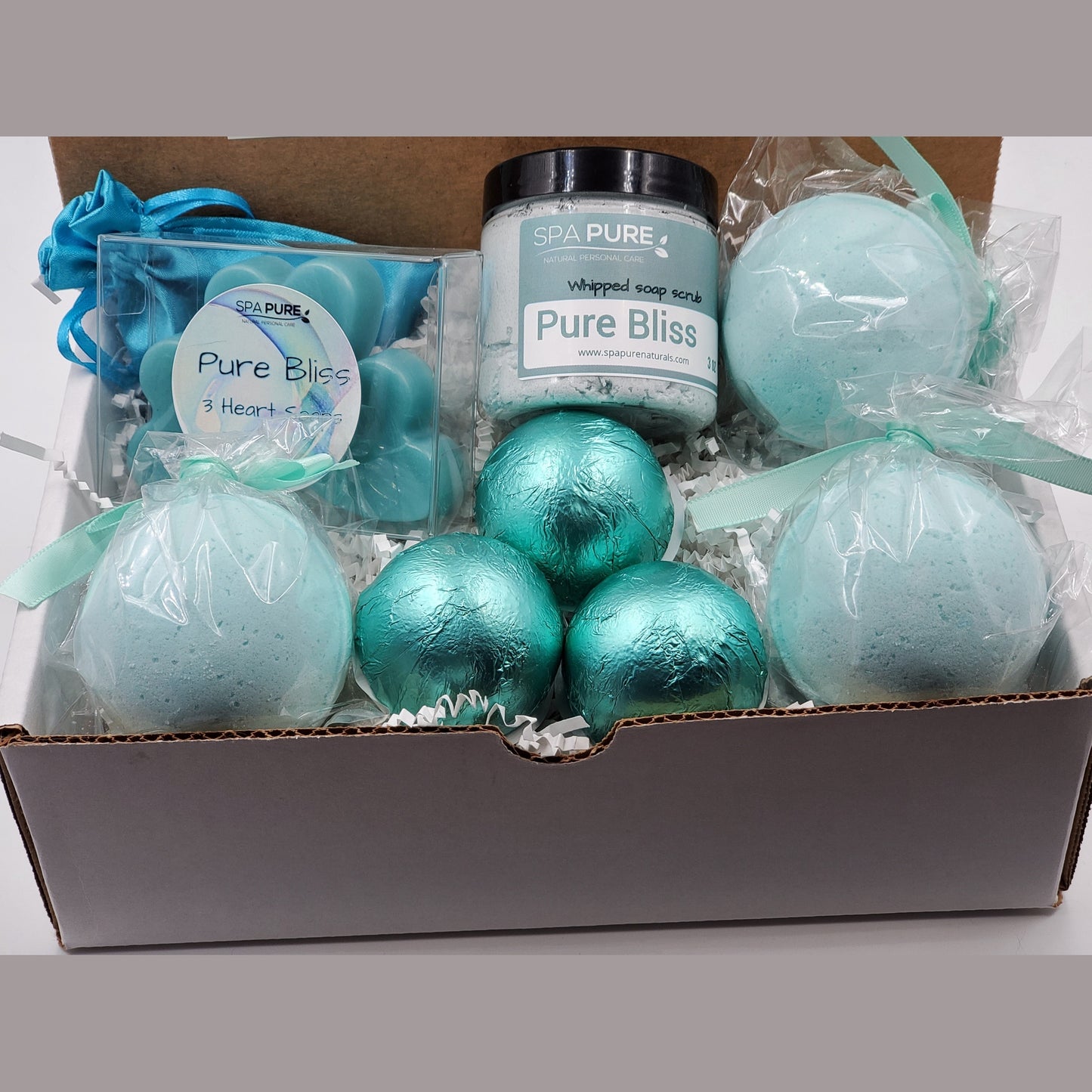 Spa Pure Luxury Spa Kit - Pure Bliss - 3 XL Pure Bliss Bath Fizzies, 3 Pure Bliss shower steamers, 3 Heart-shaped soaps, one 3.5 oz Pure Bliss whipped soap scrub, 1 Roll-on Perfume, Perfect for a mini-spa treatment.