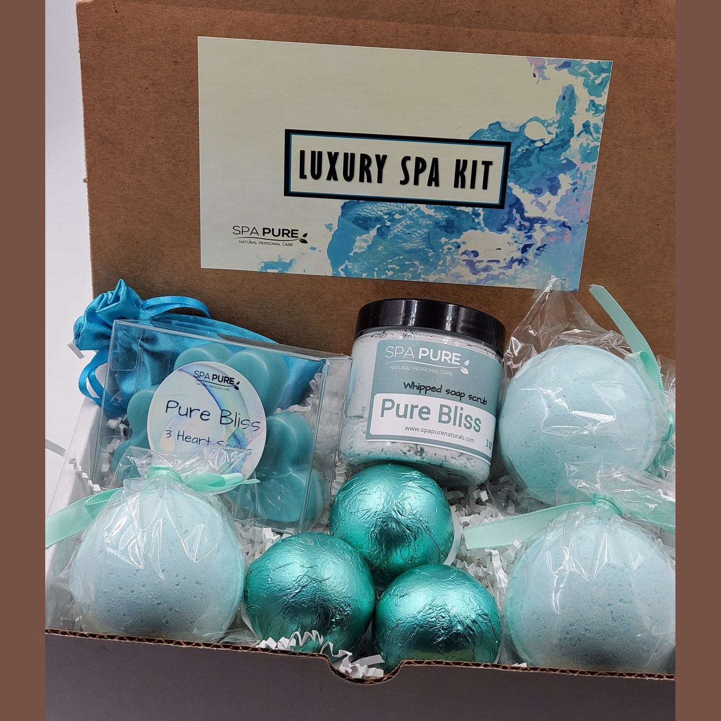Spa Pure Luxury Spa Kit - Pure Bliss - 3 XL Pure Bliss Bath Fizzies, 3 Pure Bliss shower steamers, 3 Heart-shaped soaps, one 3.5 oz Pure Bliss whipped soap scrub, 1 Roll-on Perfume, Perfect for a mini-spa treatment.