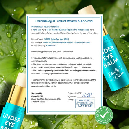 Under eye balm packaging with a dermatologist approval document on a green leaf background
