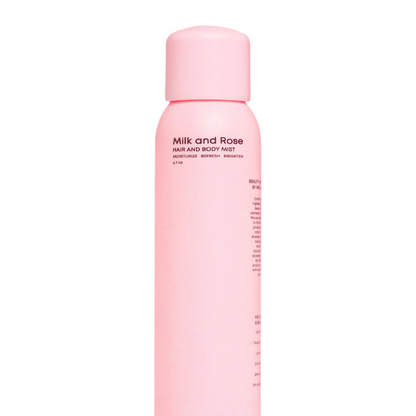 Pink bottle of Milk and Rose hair and body mist on a white background