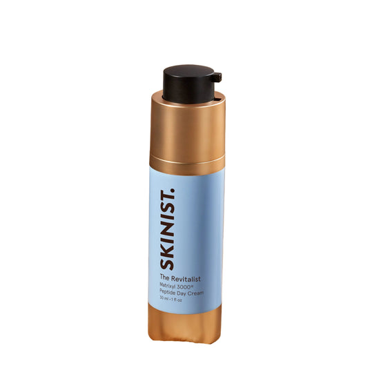 Skincare bottle with gold cap and blue label on a white background