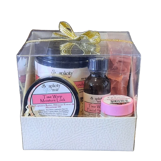 Gift set with skincare products in a clear box with a white background 