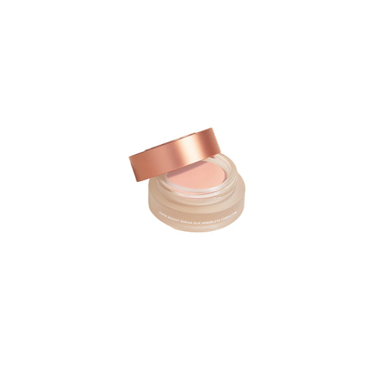 Cosmetic jar with rose gold lid on a white background