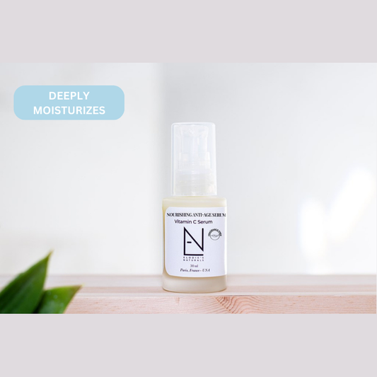 Vitamin C serum bottle on a wooden surface with a light background