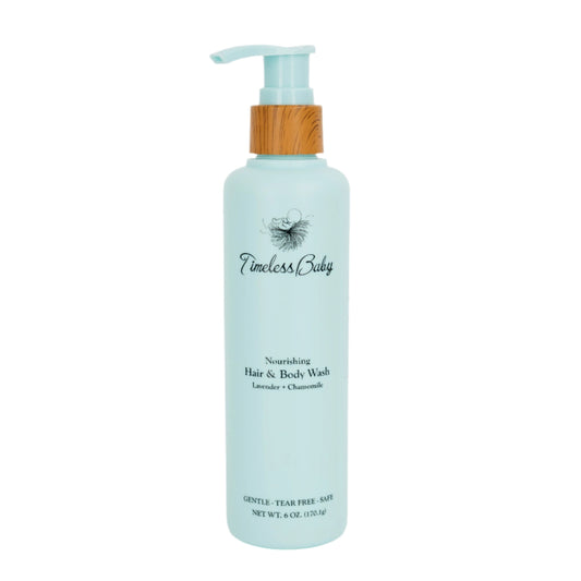 Blue bottle of Timeless Baby hair and body wash with pump on a white background